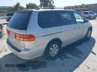 2002 Honda Odyssey EX z VIN 2HKRL186X2H513999, wystawiony jako IAAI lot #42348131 z przebiegiem 252 202 mil mil oraz . Historia ofert i sprzedaży dostępna na DreamBid. Obrazek 4.