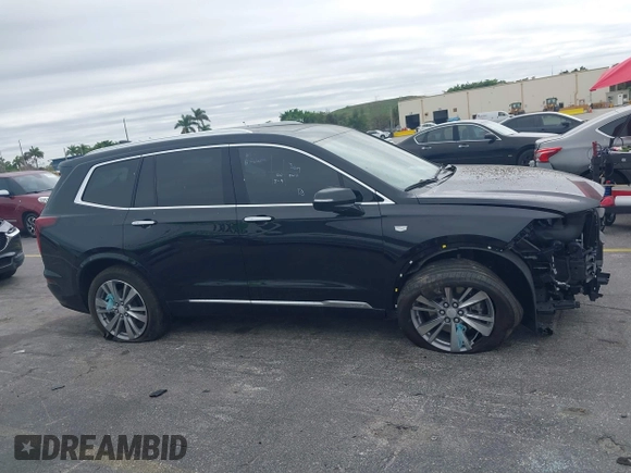 2023 Cadillac XT6 FWD Premium Luxury with VIN 1GYKPCRS6PZ106284, listed as a IAAI auction lot 41595617 with 32,795 mi miles and . Bid and sale history available at DreamBid. Image 14.
