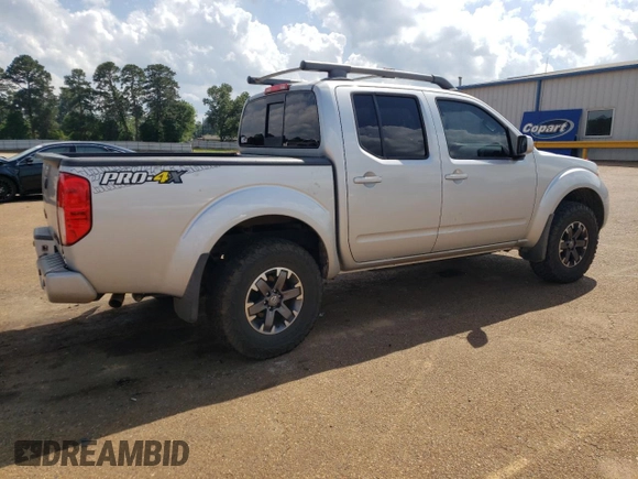 2016 Nissan Frontier Pro-4X with VIN 1N6AD0EV0GN797437, listed as a Copart auction lot 54203245 with 131,021 mi miles and Salvage title. Bid and sale history available at DreamBid. Image 3.