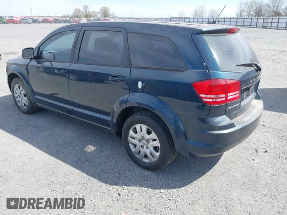 2014 Dodge Journey American Value Pkg with VIN 3C4PDCAB7ET101132, listed as a IAAI auction lot 41802381 with 101,895 mi miles. Bid and sale history available at carsss.com. Image 3.