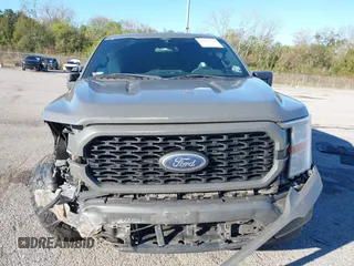 2021 Ford F-150 XL z VIN 1FTEW1EP3MKE33600, wystawiony jako IAAI lot #41053750 z przebiegiem 140 085 mil mil oraz . Historia ofert i sprzedaży dostępna na DreamBid. Obrazek 12.