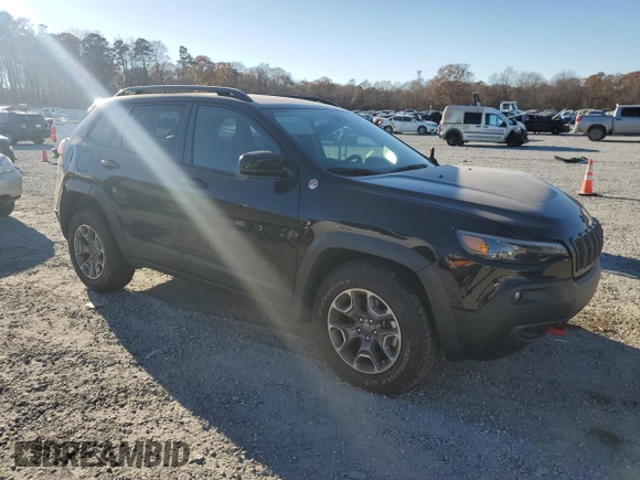 2022 Jeep Cherokee Trailhawk with VIN 1C4PJMBX5ND549237, listed as a Copart auction lot 83760264 with 24,756 mi miles and Salvage Title. Bid and sale history available at carsss.com. Image 4.