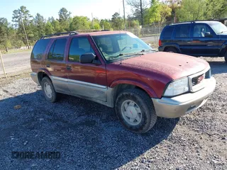 2000 GMC Jimmy SL with VIN 1GKCS13W1Y2157134, listed as a IAAI auction lot 41981434 with 240,248 mi miles. Bid and sale history available at carsss.com. Image 1.