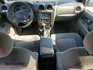 2004 GMC Envoy SLE z VIN 1GKDT13S842242030, wystawiony jako Copart lot #56712035 z przebiegiem 186 749 mil mil oraz Szkody całkowita. Historia ofert i sprzedaży dostępna na DreamBid. Obrazek 8.