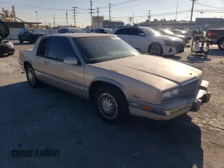 1988 Cadillac Eldorado with VIN 1G6EL1153JU612185, listed as a Copart auction lot 83786144 with 133,882 mi miles and Salvage Title. Bid and sale history available at DreamBid. Image 4.