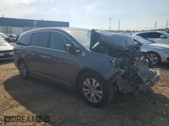 2014 Honda Odyssey EX-L with VIN 5FNRL5H61EB046093, listed as a Copart auction lot 61930335 with Not provided miles and Salvage title. Bid and sale history available at DreamBid. Image 4.