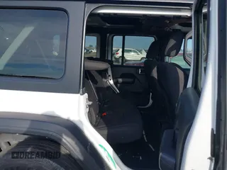 2022 Jeep Wrangler Unlimited Sport S with VIN 1C4HJXDN9NW154922, listed as a IAAI auction lot 41230408 with 35,187 mi miles. Bid and sale history available at carsss.com. Image 8.