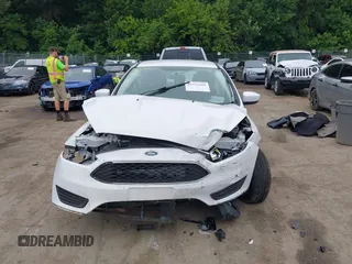 2018 Ford Focus SE z VIN 1FADP3F24JL247003, wystawiony jako IAAI lot #42531969 z przebiegiem 55 344 mil mil oraz . Historia ofert i sprzedaży dostępna na DreamBid. Obrazek 12.