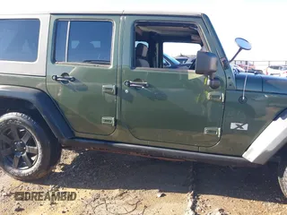 2008 Jeep Wrangler Unlimited X with VIN 1J8GA39118L594626, listed as a IAAI auction lot 41618878 with 166,071 mi miles and . Bid and sale history available at DreamBid. Image 13.