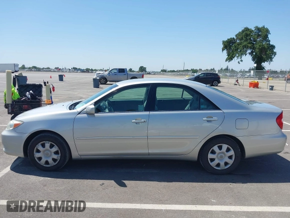 2004 Toyota Camry LE with VIN 4T1BE32K74U300025, listed as a IAAI auction lot 42035954 with 115,203 mi miles. Bid and sale history available at carsss.com. Image 14.