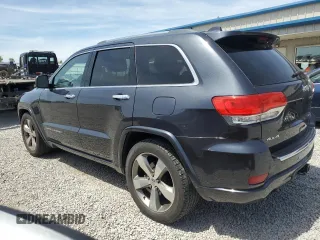 2016 Jeep Grand Cherokee Overland with VIN 1C4RJFCG9GC338165, listed as a Copart auction lot 54125815 with 102,302 mi miles and Salvage title. Bid and sale history available at DreamBid. Image 2.