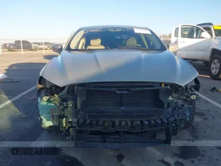 2015 Ford Fusion SE z VIN 3FA6P0H79FR137377, wystawiony jako IAAI lot #41345497 z przebiegiem 170 533 mil mil oraz . Historia ofert i sprzedaży dostępna na DreamBid. Obrazek 13.
