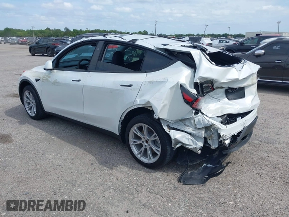 2023 Tesla Model Y Long Range with VIN 7SAYGDEE3PA206757, listed as a IAAI auction lot 39425483 with 5,711 mi miles and . Bid and sale history available at DreamBid. Image 3.