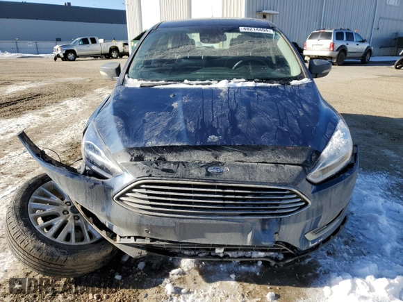 2018 Ford Focus Titanium z VIN 1FADP3N2XJL297048, wystawiony jako Copart lot #61579925 z przebiegiem 68 774 mil mil oraz Szkoda całkowita • Salvage title. Historia ofert i sprzedaży dostępna na DreamBid. Obrazek 5.