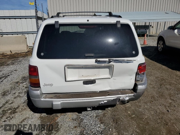 1996 Jeep Grand Cherokee Laredo with VIN 1J4FX58SXTC349575, listed as a Copart auction lot 80545584 with 302,636 mi miles and Salvage Title. Bid and sale history available at carsss.com. Image 6.