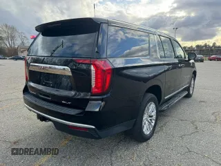 2021 GMC Yukon XL SLT with VIN 1GKS2GKDXMR238116, listed as a Copart auction lot 87132704 with 106,975 mi miles and Clean Title. Bid and sale history available at carsss.com. Image 4.