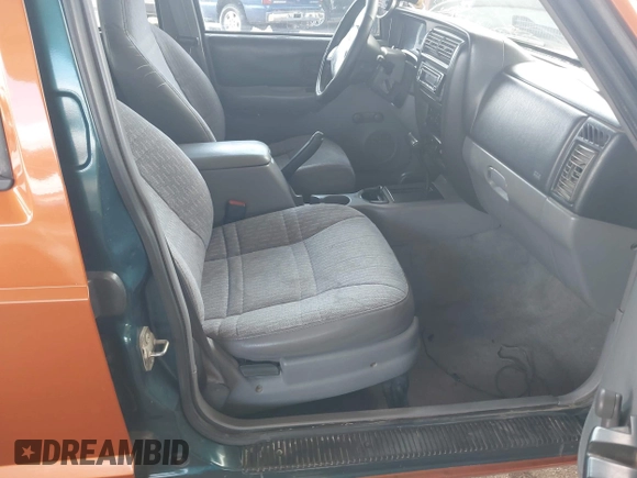 1997 Jeep Cherokee Sport with VIN 1J4FJ68SXVL517077, listed as a IAAI auction lot 42350553 with Not provided miles and . Bid and sale history available at DreamBid. Image 5.