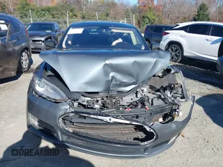 2013 Tesla Model S Performance with VIN 5YJSA1DP7DFP11737, listed as a IAAI auction lot 40915195 with Not provided miles and . Bid and sale history available at DreamBid. Image 11.