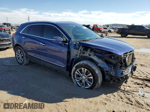 2023 Cadillac XT5 FWD Premium Luxury with VIN 1GYKNCRS3PZ154122, listed as a Copart auction lot 43063675 with 52,279 mi miles and Salvage Title. Bid and sale history available at carsss.com. Image 4.