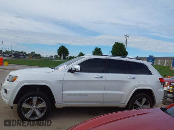 2016 Jeep Grand Cherokee Overland with VIN 1C4RJFCG2GC490420, listed as a IAAI auction lot 42200700 with 97,007 mi miles and . Bid and sale history available at DreamBid. Image 14.
