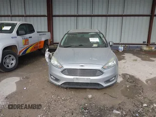 2015 Ford Focus Titanium z VIN 1FADP3N2XFL348149, wystawiony jako IAAI lot #41983021 z przebiegiem 208 765 mil mil oraz . Historia ofert i sprzedaży dostępna na DreamBid. Obrazek 12.
