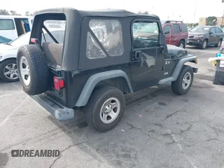 2002 Jeep Wrangler X with VIN 1J4FA39S92P774054, listed as a IAAI auction lot 41470351 with 209,727 mi miles. Bid and sale history available at carsss.com. Image 4.