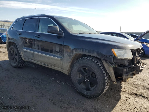 2011 Jeep Grand Cherokee Laredo with VIN 1J4RR4GG4BC624399, listed as a Copart auction lot 52796525 with 242,317 mi miles and Clean Title. Bid and sale history available at carsss.com. Image 4.