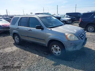 2006 Honda CR-V LX with VIN JHLRD68516C006561, listed as a IAAI auction lot 41855457 with 215,139 mi miles. Bid and sale history available at carsss.com. Image 1.