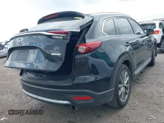 2018 Mazda CX-9 Grand Touring with VIN JM3TCADY3J0205878, listed as a IAAI auction lot 42178507 with 243,703 mi miles and . Bid and sale history available at DreamBid. Image 4.