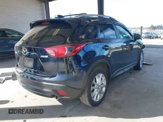 2014 Mazda CX-5 Grand Touring with VIN JM3KE2DY6E0394172, listed as a IAAI auction lot 41698468 with 89,554 mi miles. Bid and sale history available at carsss.com. Image 4.
