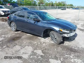 2019 Honda Insight Touring z VIN 19XZE4F97KE023811, wystawiony jako IAAI lot #42464589 z przebiegiem 103 950 mil mil oraz . Historia ofert i sprzedaży dostępna na DreamBid. Obrazek 1.
