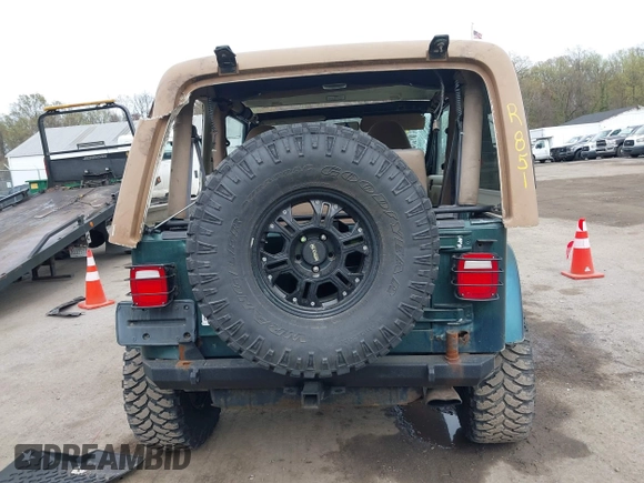 1999 Jeep Wrangler Sahara with VIN 1J4FY49S7XP440582, listed as a IAAI auction lot 41967151 with 163,710 mi miles and . Bid and sale history available at DreamBid. Image 16.