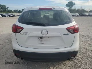2016 Mazda CX-5 Sport with VIN JM3KE2BY0G0729349, listed as a Copart auction lot 62469735 with 88,247 mi miles and Salvage title. Bid and sale history available at DreamBid. Image 6.