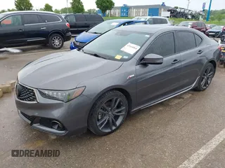 2019 Acura TLX w/A-Spec Pkg z VIN 19UUB2F61KA000932, wystawiony jako IAAI lot #42164064 z przebiegiem 79 080 mil mil oraz . Historia ofert i sprzedaży dostępna na DreamBid. Obrazek 19.
