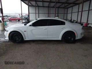 2023 Dodge Charger Scat Pack Widebody with VIN 2C3CDXGJ9PH516473, listed as a IAAI auction lot 41188167 with 38,021 mi miles and . Bid and sale history available at DreamBid. Image 14.