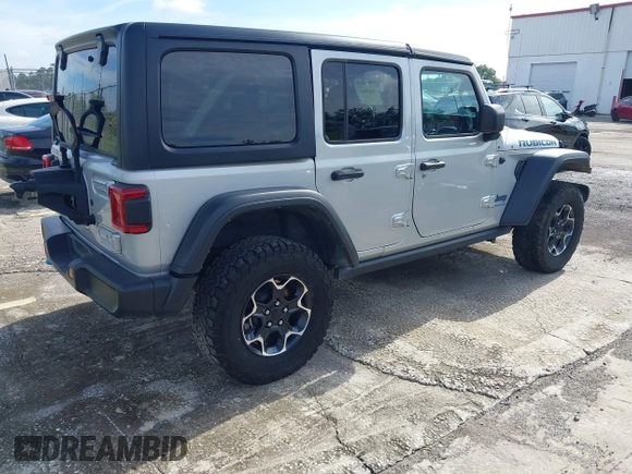 2023 Jeep Wrangler Rubicon with VIN 1C4JJXR63PW703424, listed as a IAAI auction lot 42639653 with 46,412 mi miles and . Bid and sale history available at DreamBid. Image 4.