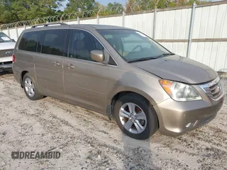 2010 Honda Odyssey Touring with VIN 5FNRL3H9XAB094779, listed as a IAAI auction lot 40412812 with 145,533 mi miles. Bid and sale history available at carsss.com. Image 1.
