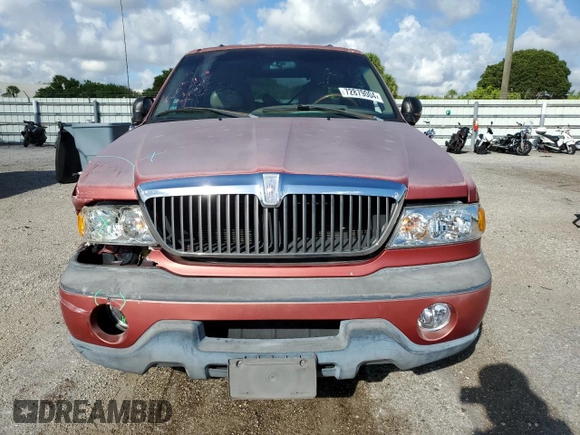 1999 Lincoln Navigator z VIN 5LMRU27A2XLJ41370, wystawiony jako Copart lot #72879004 z przebiegiem Nie podano mil oraz Szkoda całkowita • Salvage title. Historia ofert i sprzedaży dostępna na DreamBid. Obrazek 5.