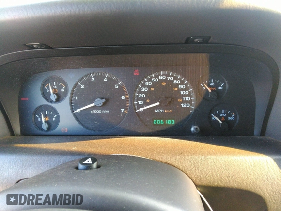 1999 Jeep Grand Cherokee Limited with VIN 1J4GW68N8XC770305, listed as a IAAI auction lot 41720558 with 206,180 mi miles. Bid and sale history available at carsss.com. Image 7.