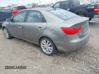 2010 Kia Forte SX with VIN KNAFW4A31A5048066, listed as a IAAI auction lot 42102810 with 160,998 mi miles. Bid and sale history available at carsss.com. Image 3.