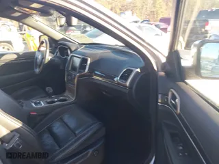 2014 Jeep Grand Cherokee Overland with VIN 1C4RJFCGXEC162238, listed as a IAAI auction lot 41291512 with 88,261 mi miles. Bid and sale history available at carsss.com. Image 5.
