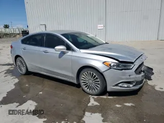 2018 Ford Fusion Titanium z VIN 3FA6P0D96JR155318, wystawiony jako Copart lot #53740505 z przebiegiem 86 567 mil mil oraz Szkoda całkowita • Salvage title. Historia ofert i sprzedaży dostępna na DreamBid. Obrazek 4.