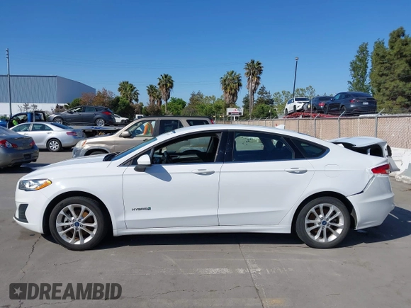 2019 Ford Fusion Hybrid SE with VIN 3FA6P0LU9KR207824, listed as a IAAI auction lot 42153330 with 69,966 mi miles. Bid and sale history available at carsss.com. Image 14.