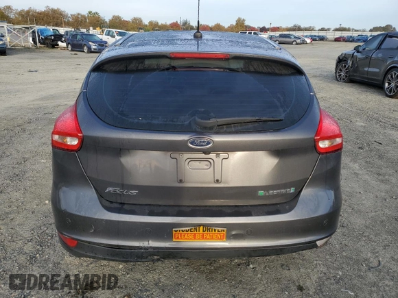2015 Ford Focus Electric with VIN 1FADP3R43FL221870, listed as a Copart auction lot 79549284 with 67,079 mi miles and Salvage title. Bid and sale history available at DreamBid. Image 6.
