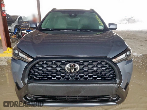 2023 Toyota Corolla Cross LE with VIN 7MUBAAAG4PV042580, listed as a Copart auction lot 63797305 with 59,576 mi miles and Salvage title. Bid and sale history available at DreamBid. Image 5.