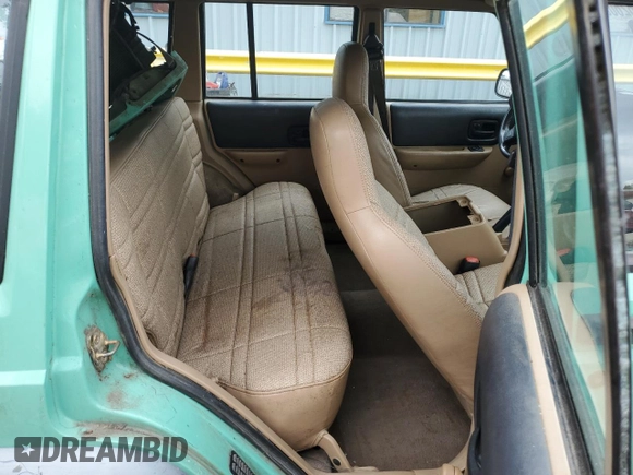 1999 Jeep Cherokee SE with VIN 1J4FF28SXXL641556, listed as a Copart auction lot 62605065 with Not provided miles and Salvage title. Bid and sale history available at DreamBid. Image 11.