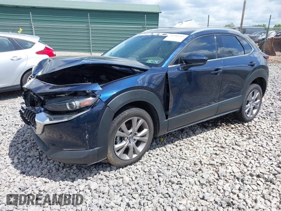 2021 Mazda CX-30 Premium z VIN 3MVDMBDL7MM236474, wystawiony jako IAAI lot #42284515 z przebiegiem 58 565 mil mil oraz . Historia ofert i sprzedaży dostępna na DreamBid. Obrazek 17.
