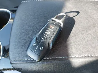 2014 Ford Fusion Titanium Hybrid with VIN 3FA6P0RUXER289087, listed as a IAAI auction lot 41418491 with 126,849 mi miles. Bid and sale history available at carsss.com. Image 11.