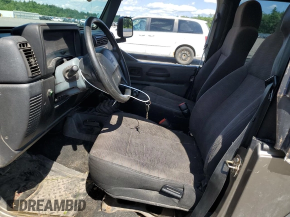 2003 Jeep Wrangler SE with VIN 1J4FA29183P335057, listed as a Copart auction lot 63523444 with 161,694 mi miles and Salvage title. Bid and sale history available at DreamBid. Image 7.