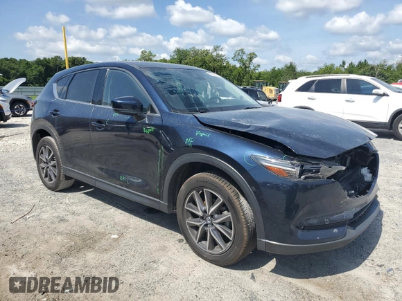 2018 Mazda CX-5 Grand Touring with VIN JM3KFADM1J1387297, listed as a Copart auction lot 60589625 with 92,283 mi miles and Non repairable. Bid and sale history available at DreamBid. Image 4.